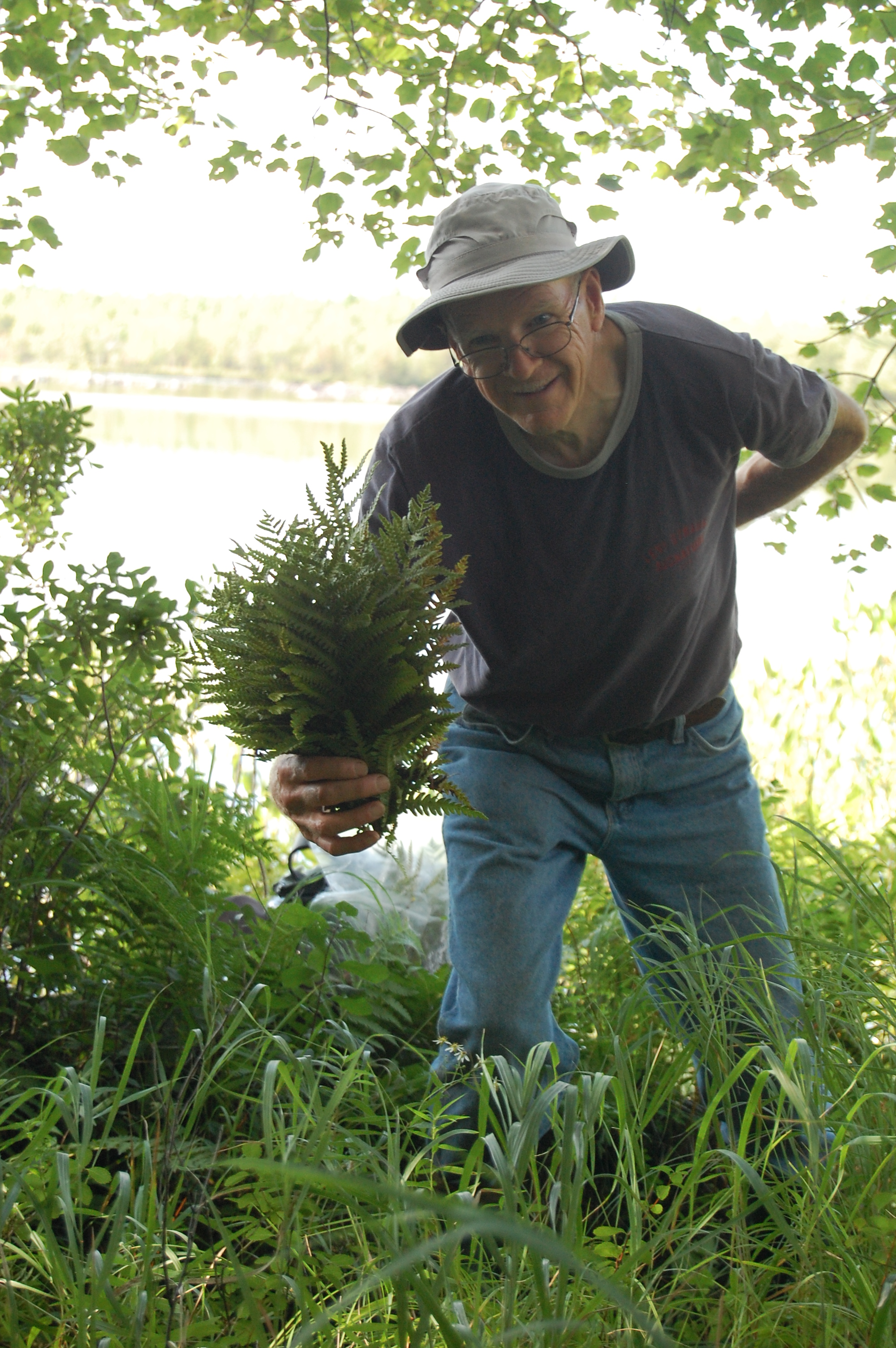 Man collecting plant samples.